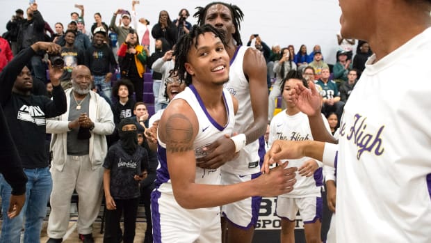 Camden's DJ Wagner is congratulated by his teammates after Wagner scored his 2,000th career point during the boys basketball game between Camden and Bishop Eustace played at Camden High School on Thursday, February 9, 2023. Camden defeated Bishop Eustace, 90-52.